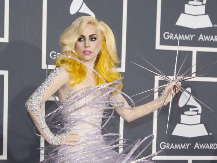 A poster of Lady Gaga in silver outfit