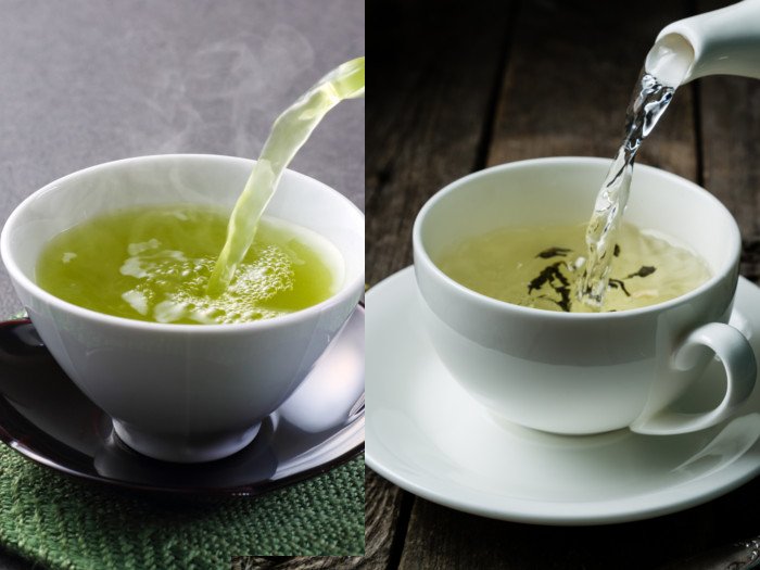 倾吐在与茶碟的单独的白色杯子的绿茶和白色茶